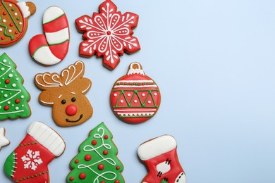 Different tasty Christmas cookies on light background, flat lay. Space for text