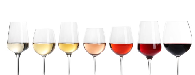 Photo of Row of glasses with different wines on white background