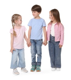 Photo of Group of cute children holding hands on white background