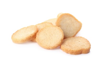 Photo of Pile of delicious crispy rusks on white background