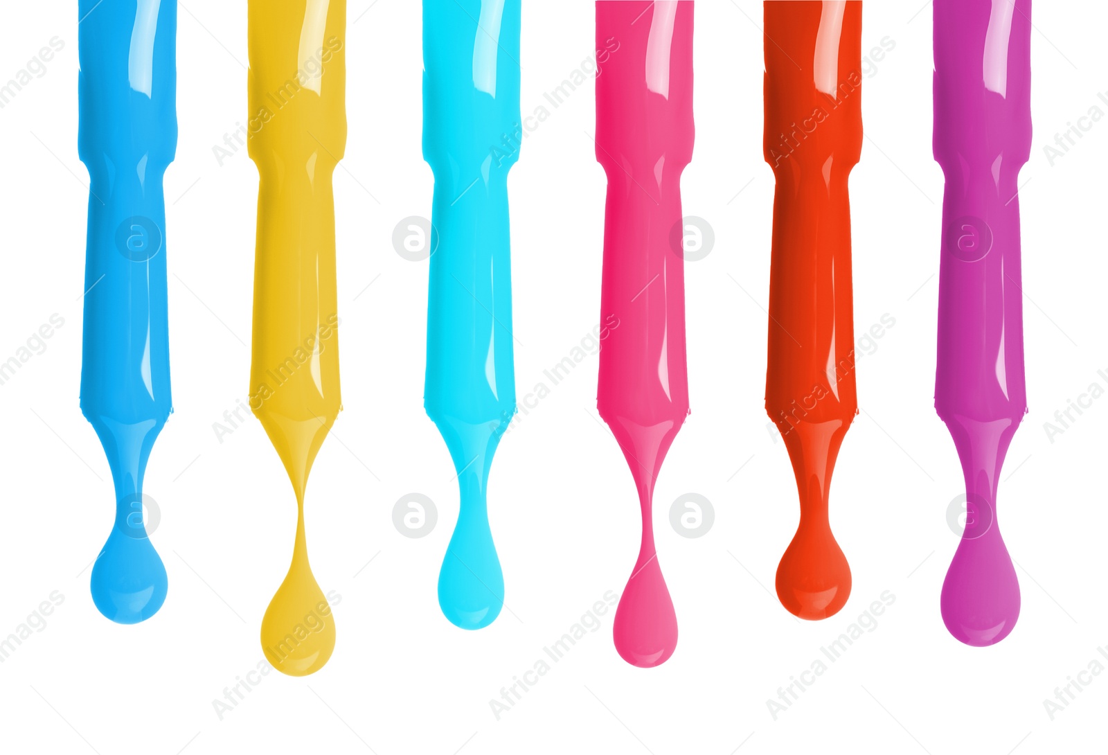 Image of Different color nail polish collection. Set of brushes with dripping liquid isolated on white