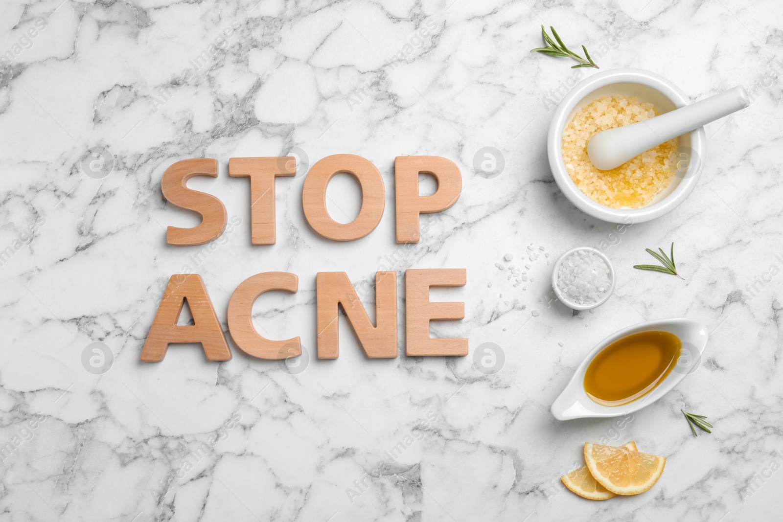 Photo of Phrase "Stop acne" and homemade problem skin remedy ingredients on light background
