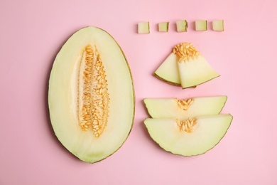 Photo of Flat lay composition with cut melon on color background