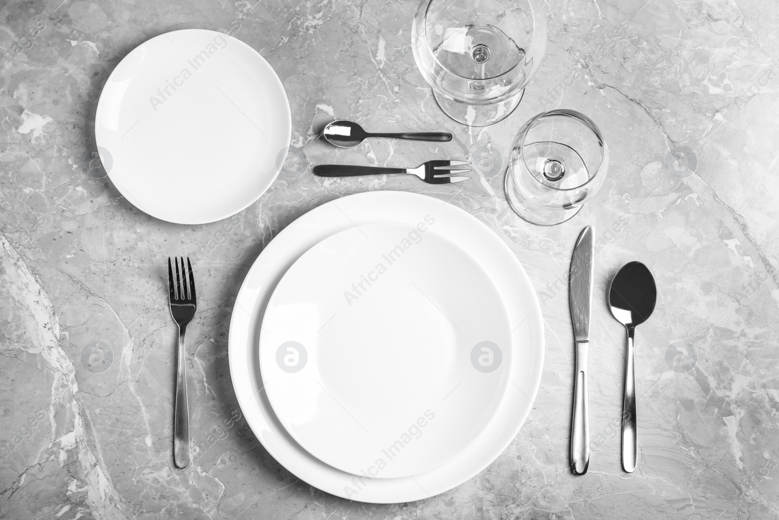 Photo of Stylish elegant table setting on grey marble surface, top view