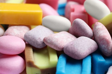 Photo of Different tasty colorful bubble gums as background, closeup