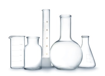 Empty clean laboratory glassware on white background