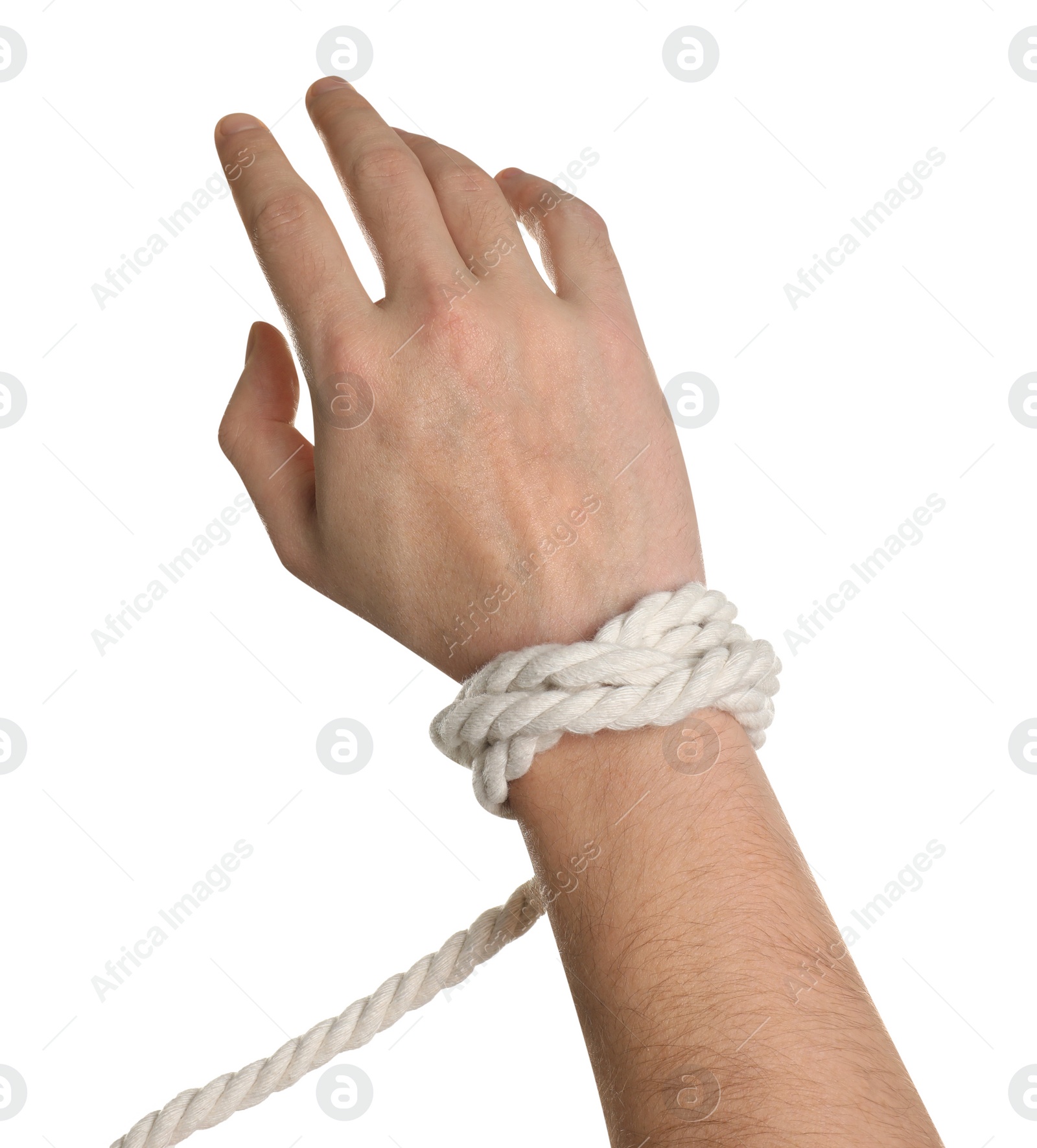Photo of Freedom concept. Man with tied rope on his hand against white background, closeup