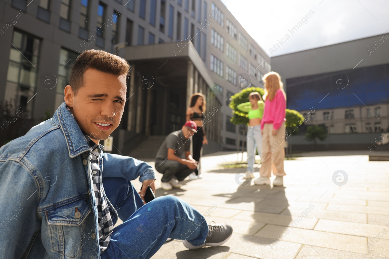 Photo of Group of people dancing hip hop outdoors, selective focus