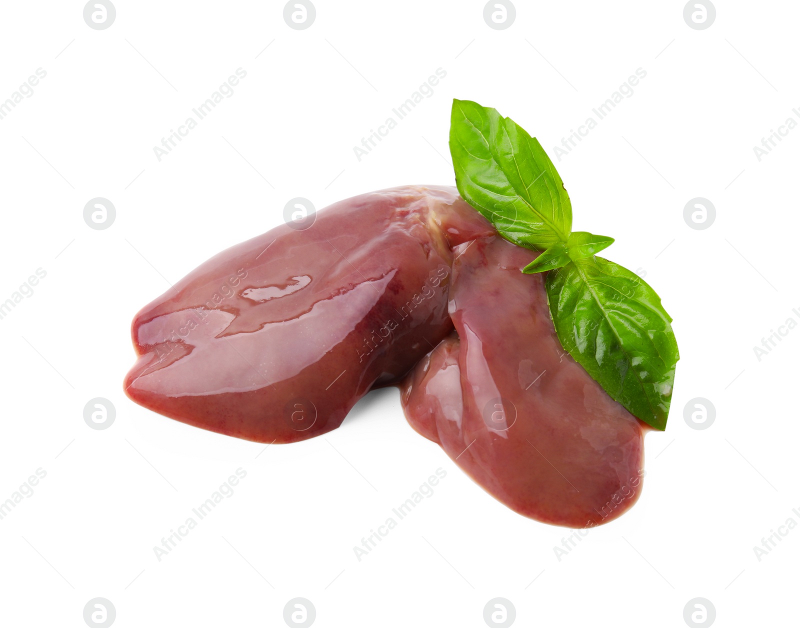 Photo of Pieces of raw chicken liver and basil isolated on white