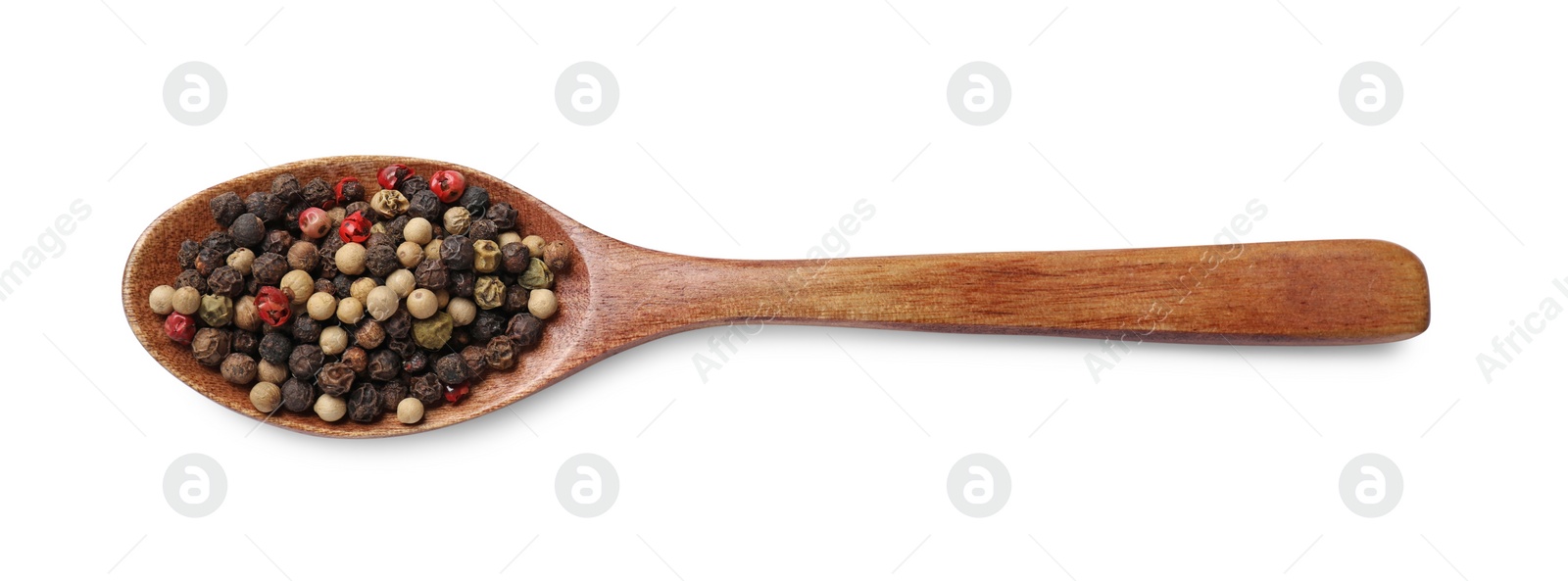 Photo of Aromatic spices. Different peppers in wooden spoon isolated on white, top view