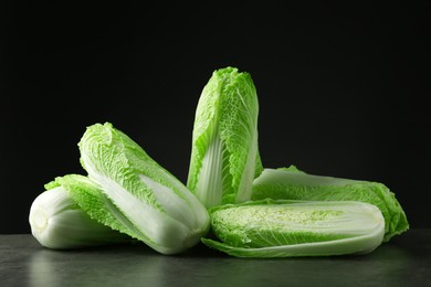 Fresh ripe Chinese cabbages on grey table