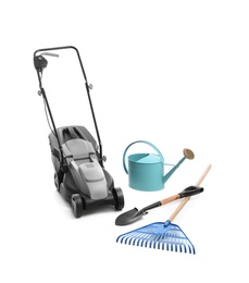 Photo of Modern electric grass cutter and gardening tools on white background