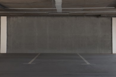 Photo of Car parking garage with white marking lines