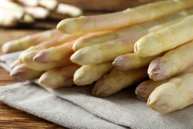 Fresh white asparagus on wooden table, closeup