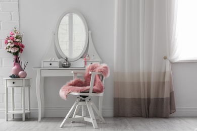 Stylish room interior with white dressing table