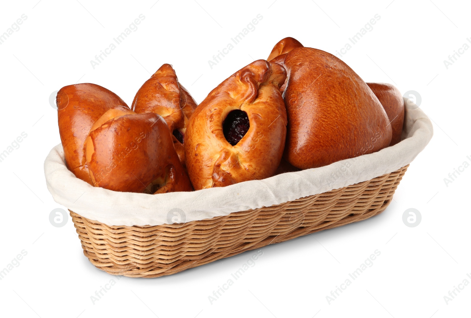 Photo of Wicker basket with delicious baked patties on white background