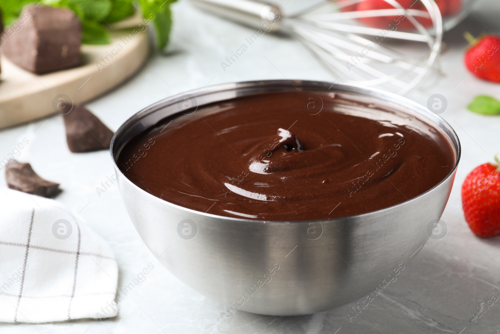 Photo of Delicious chocolate cream on grey marble table