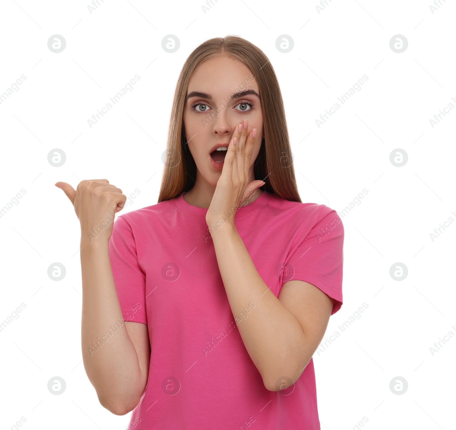 Photo of Special promotion. Emotional woman pointing at something on white background
