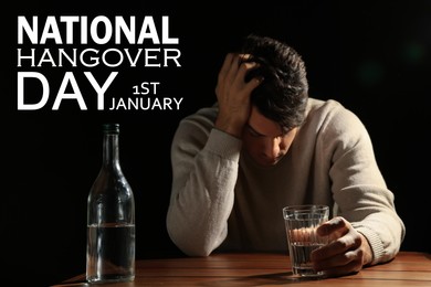 National hangover day - January 1st. Man with alcoholic drink at table against black background