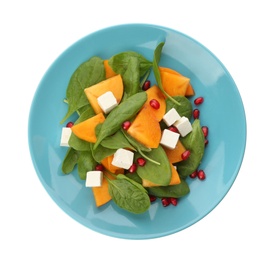 Photo of Delicious persimmon salad with pomegranate and spinach isolated on white, top view