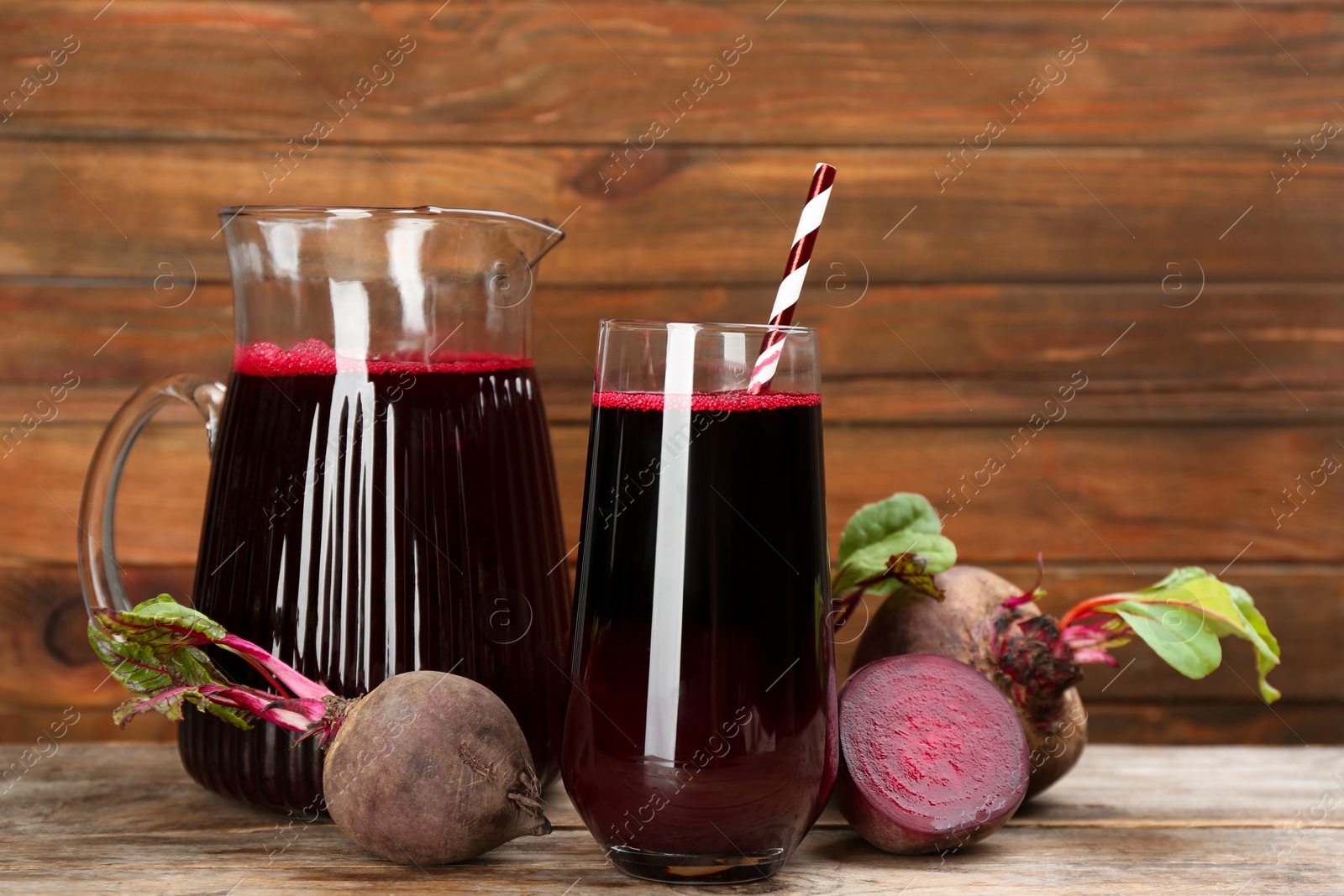 Photo of Freshly made beet juice on wooden table