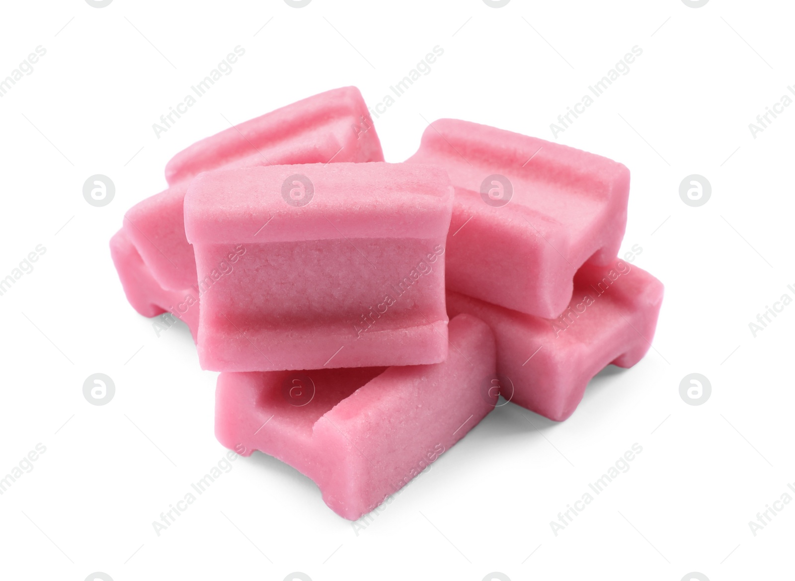 Photo of Many tasty pink chewing gums on white background