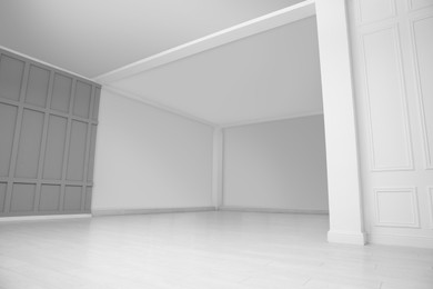 Empty room with grey wall and laminated floor