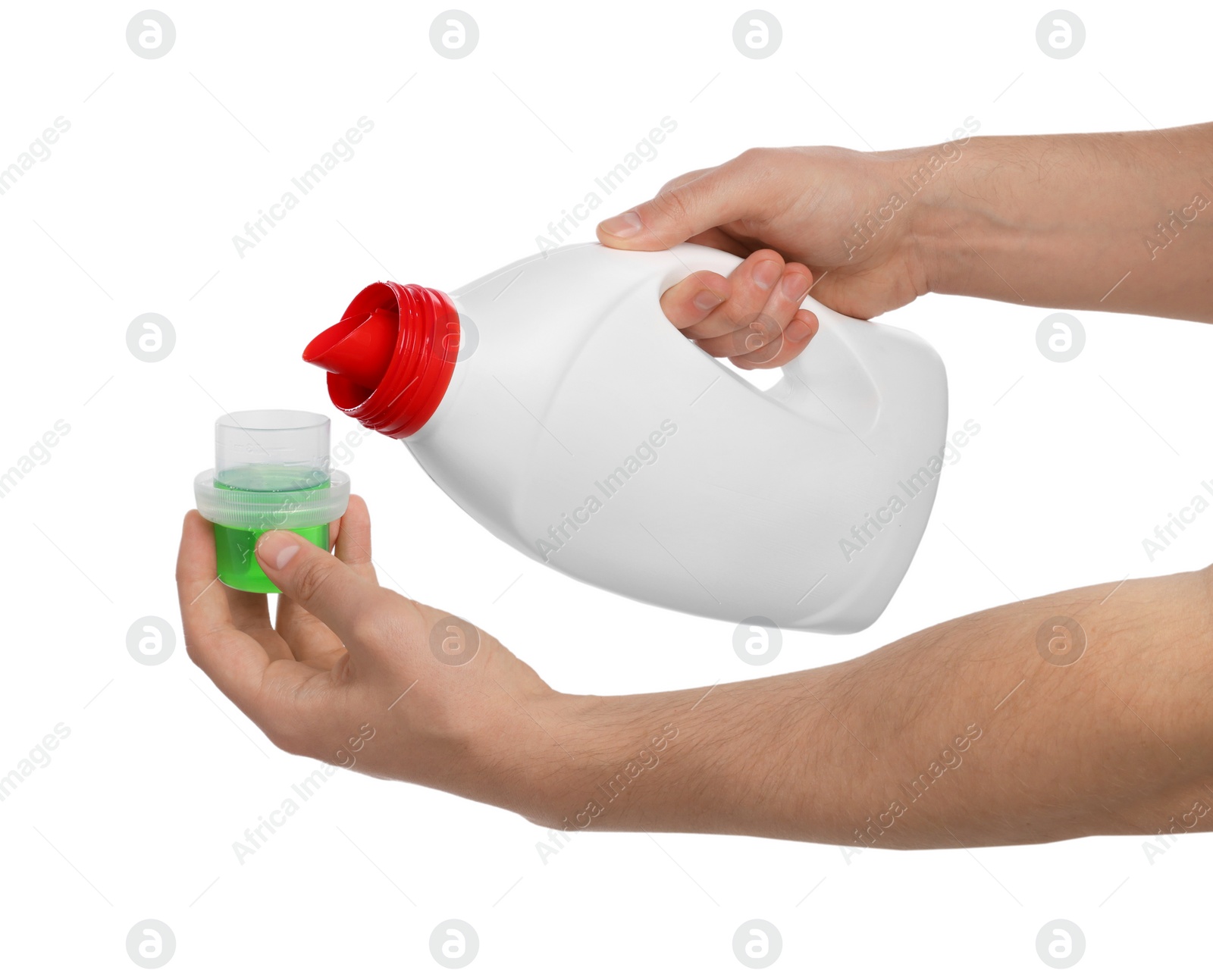 Man pouring fabric softener from bottle into cap for washing clothes on white background, closeup Photo of Man pouring fabric softener from bottle into cap for washing clothes on white background, closeup