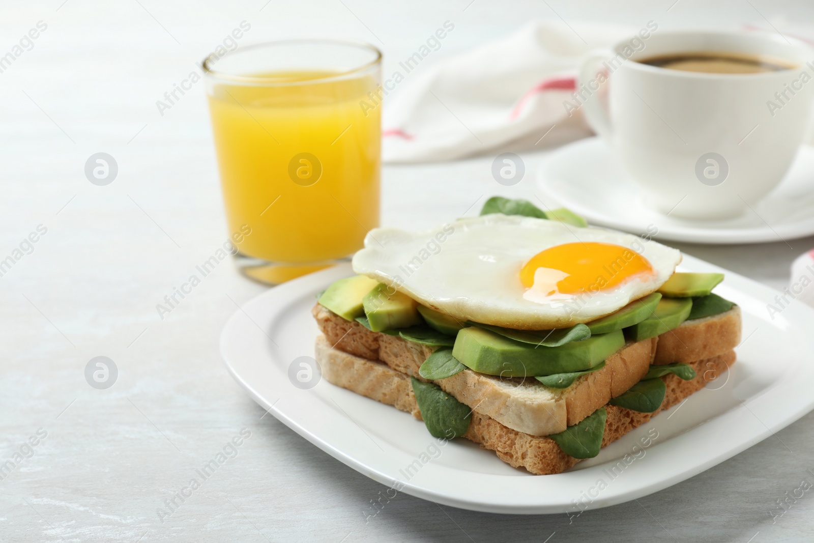 Photo of Delicious breakfast with fried egg served on table