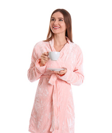 Photo of Young woman in bathrobe with cup of drink on white background