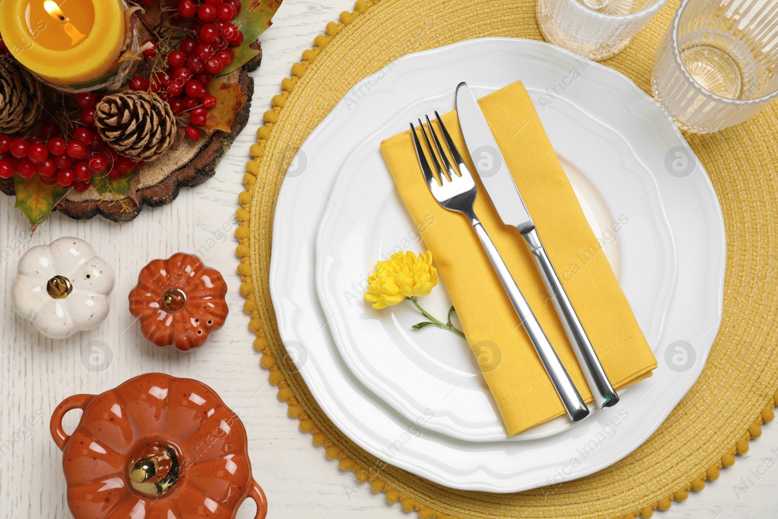 Photo of Autumn table setting with floral decor and pumpkins, flat lay