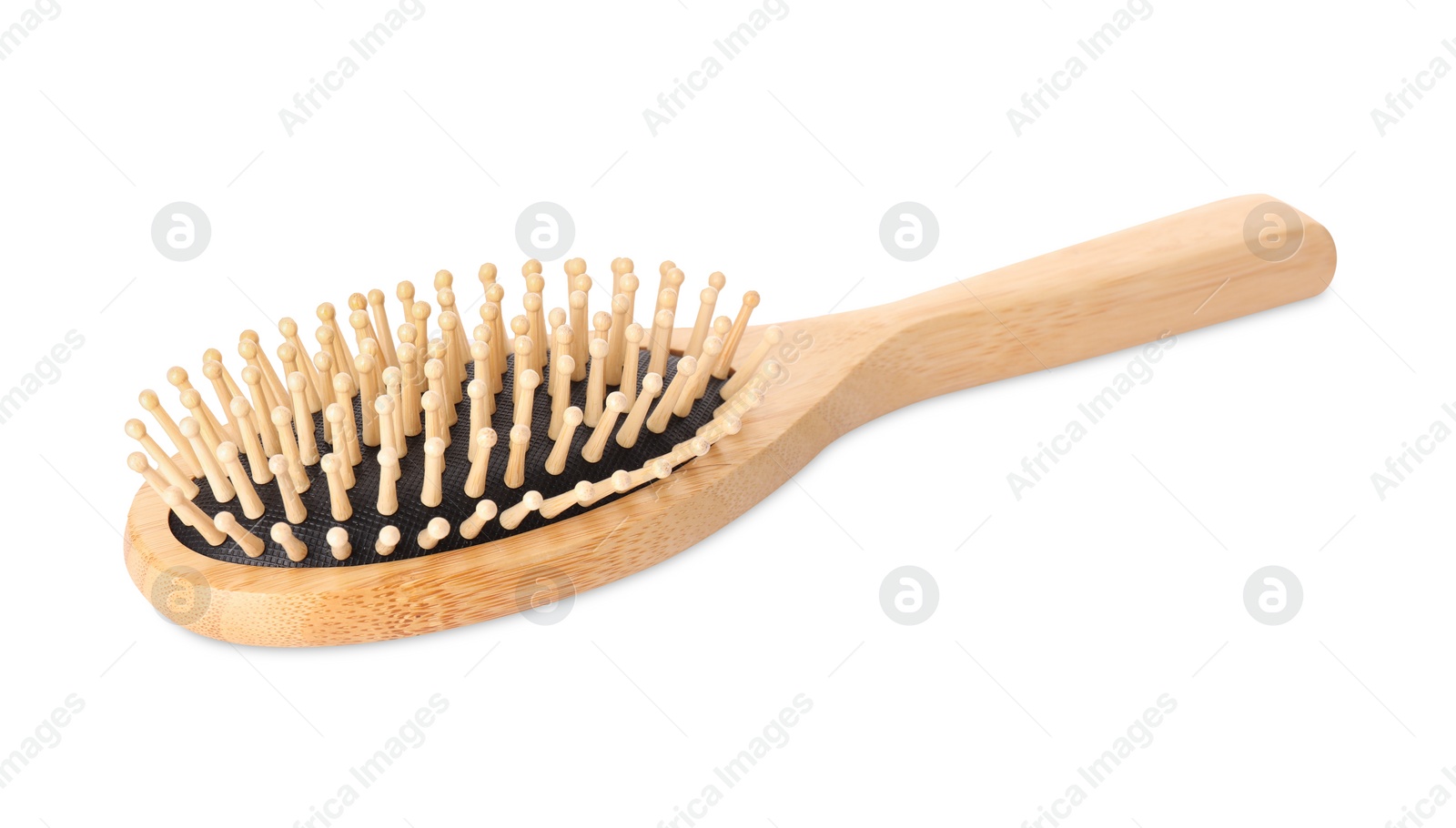 Photo of One new wooden hairbrush isolated on white