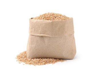 Photo of Dry wheat groats in paper bag isolated on white