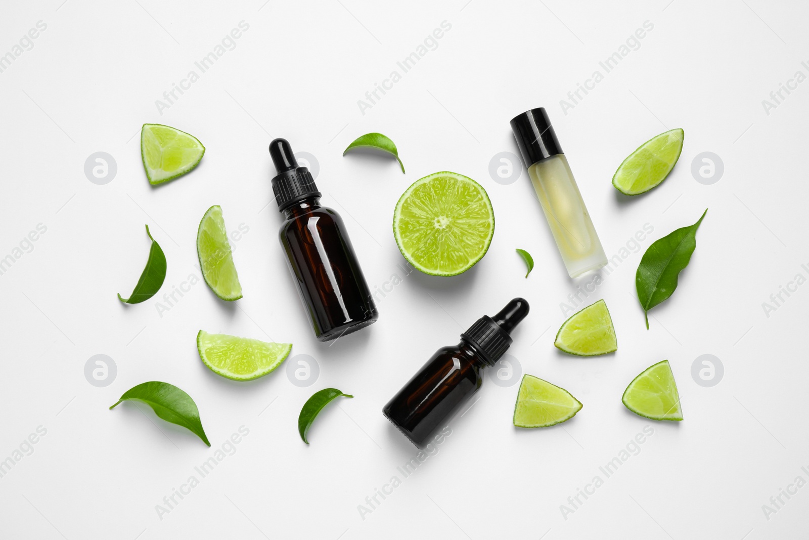 Photo of Composition with lime essential oil on white background, top view