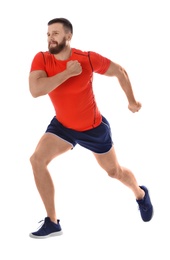 Young man in sportswear running on white background