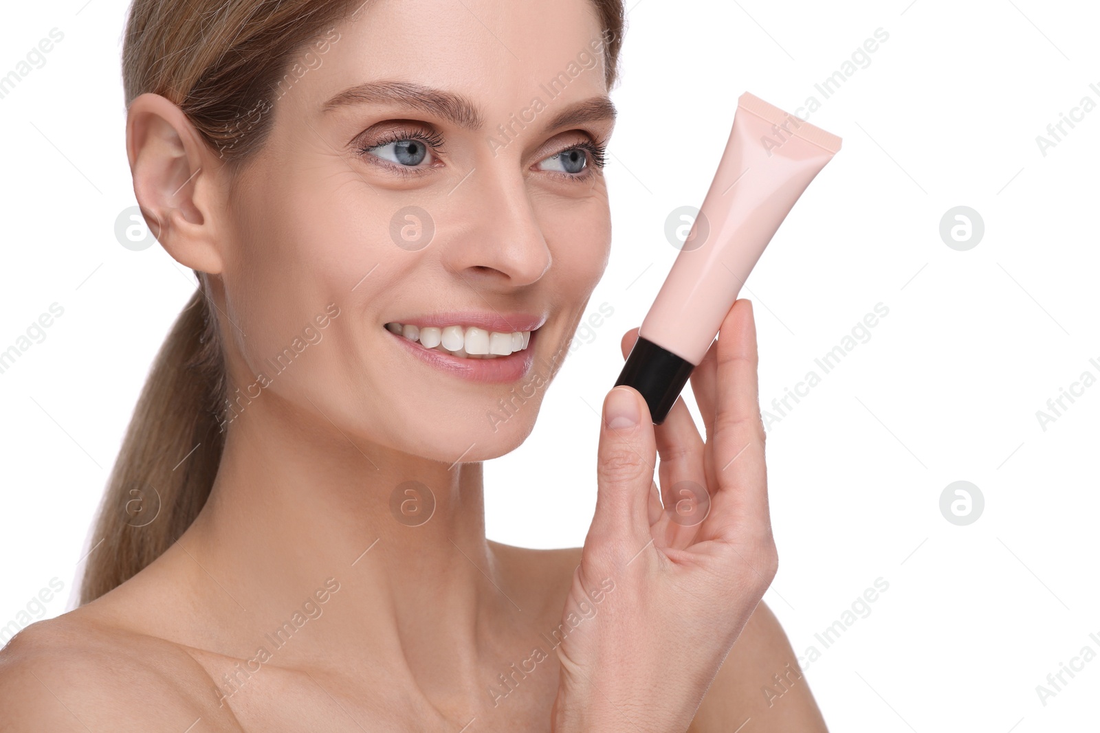 Photo of Woman holding tube with foundation on white background