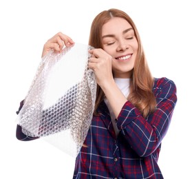 Photo of Woman popping bubble wrap on white background. Stress relief