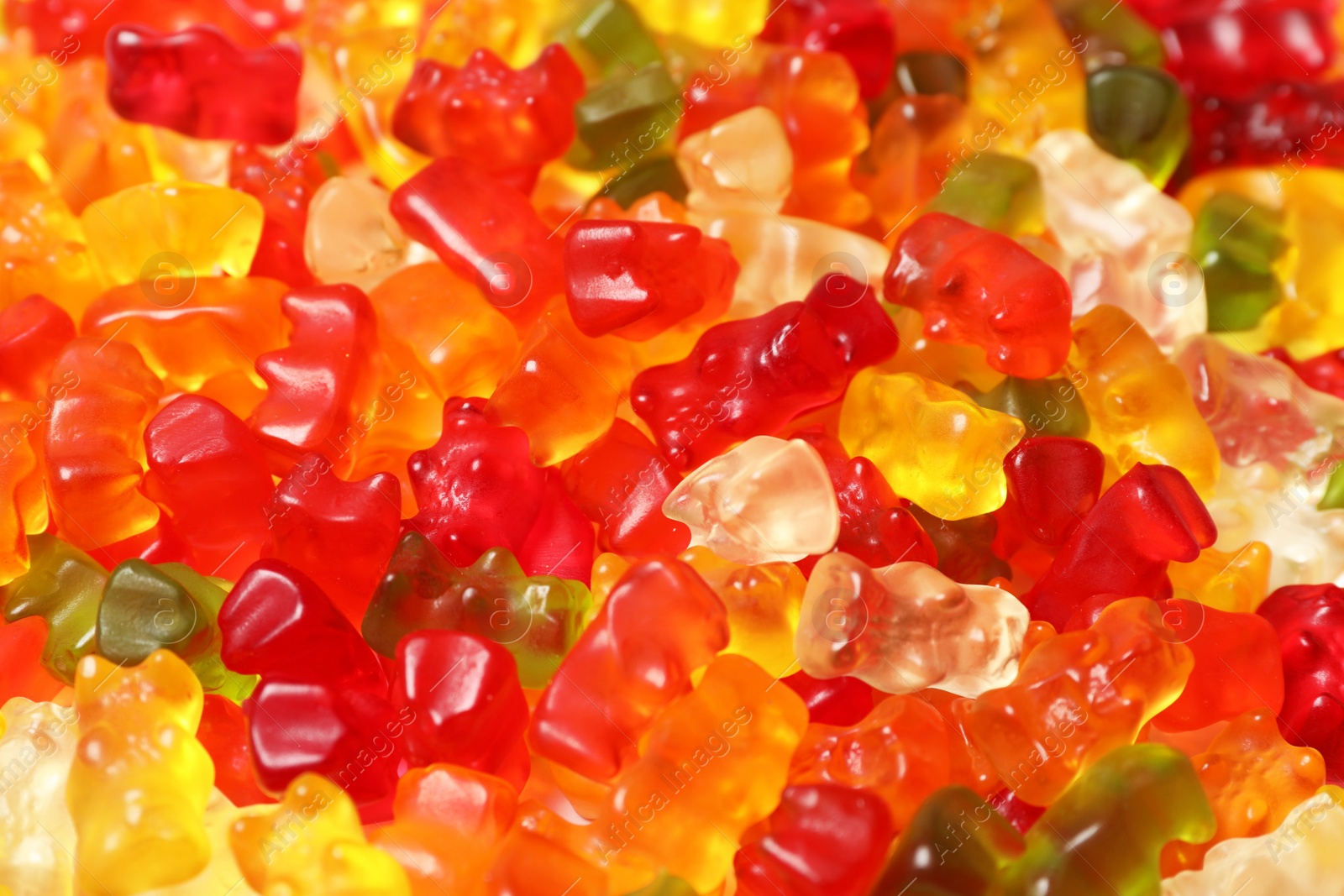 Photo of Many delicious colorful jelly bears as background, closeup