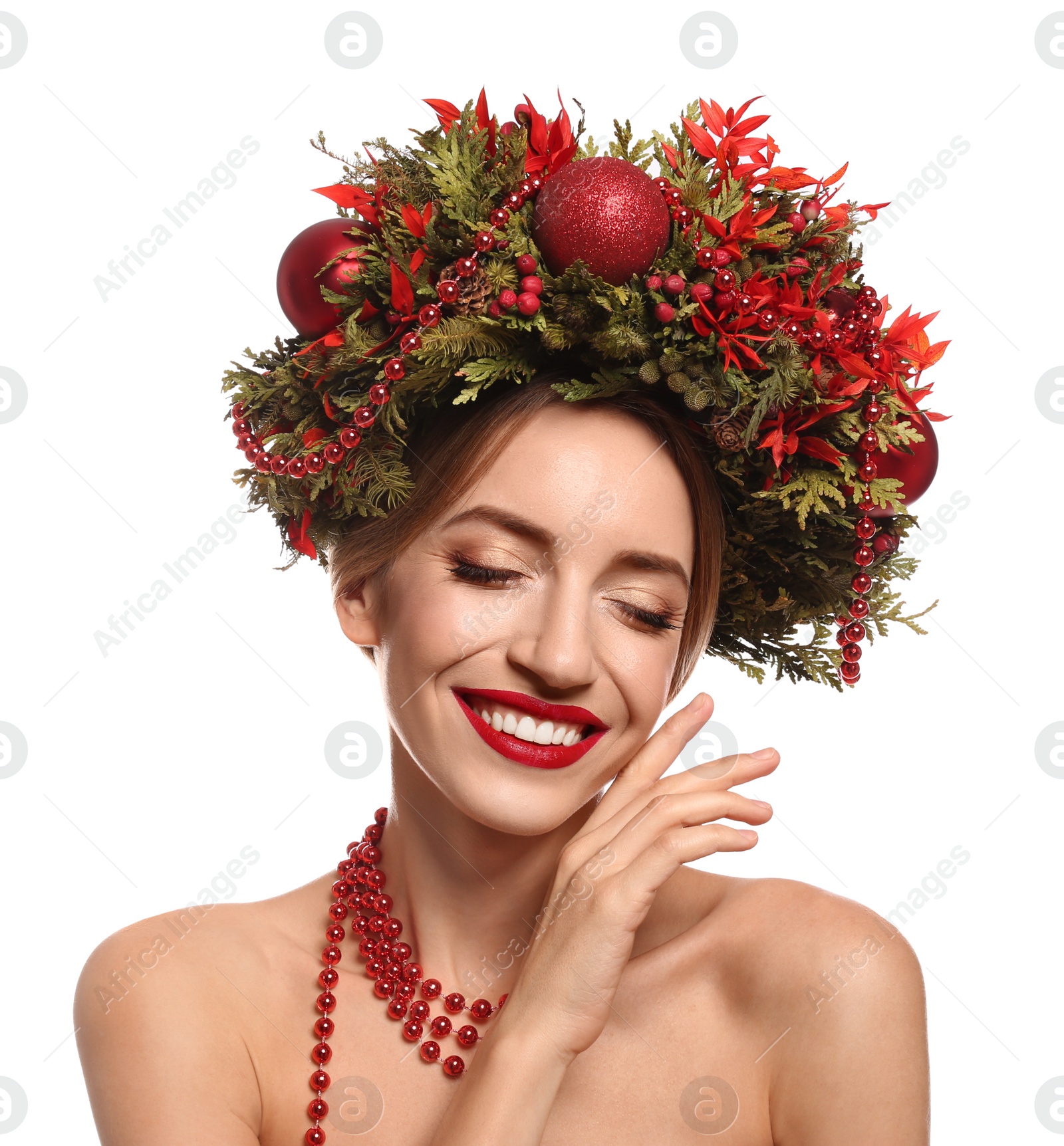 Photo of Beautiful young woman wearing Christmas wreath on white background