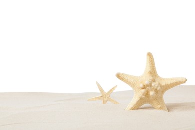 Photo of Beautiful sea stars in sand on white background