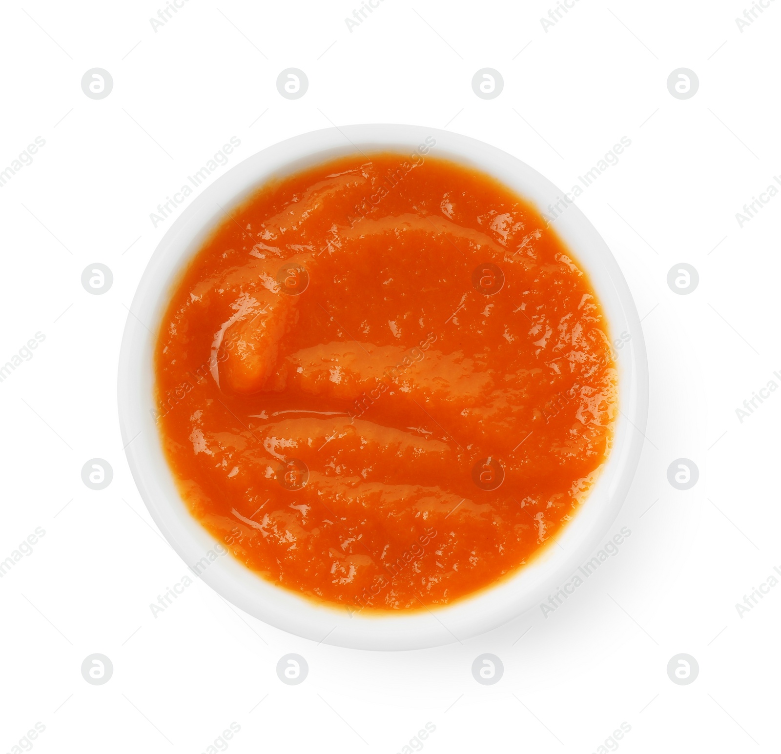 Photo of Bowl of healthy baby food isolated on white, top view