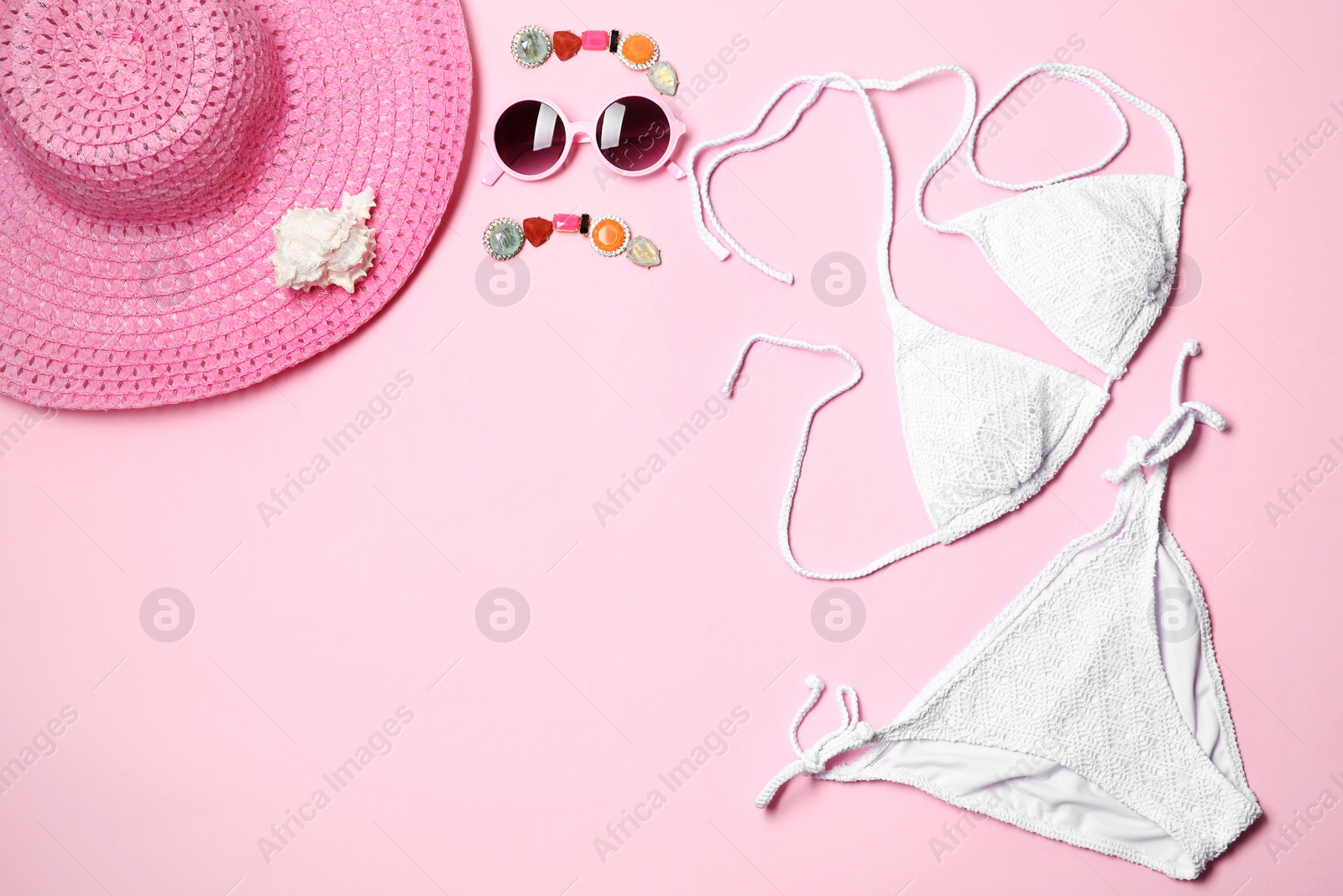 Photo of Flat lay composition with stylish bikini on color background. Space for text