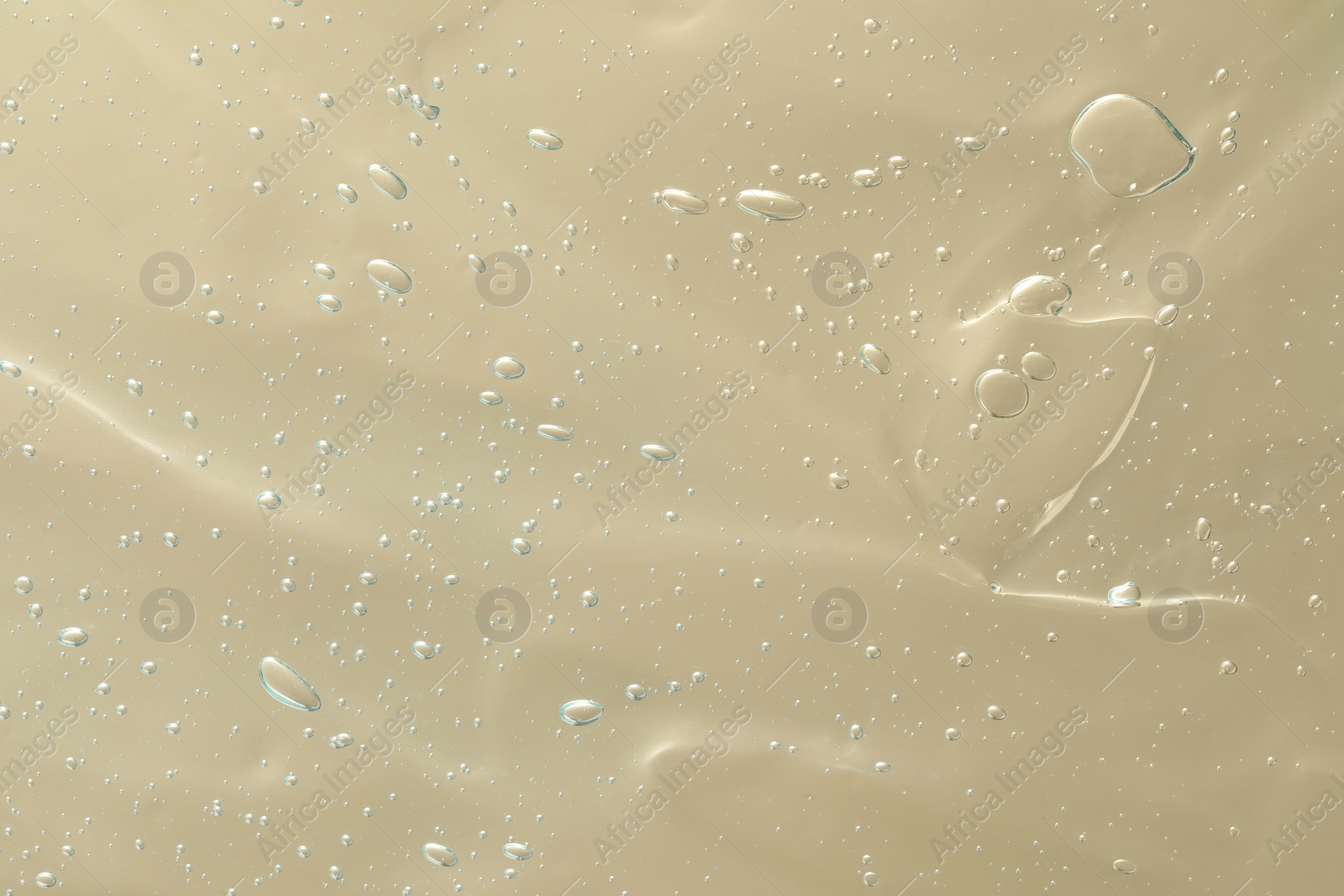 Photo of Transparent cleansing gel as background, closeup. Cosmetic product
