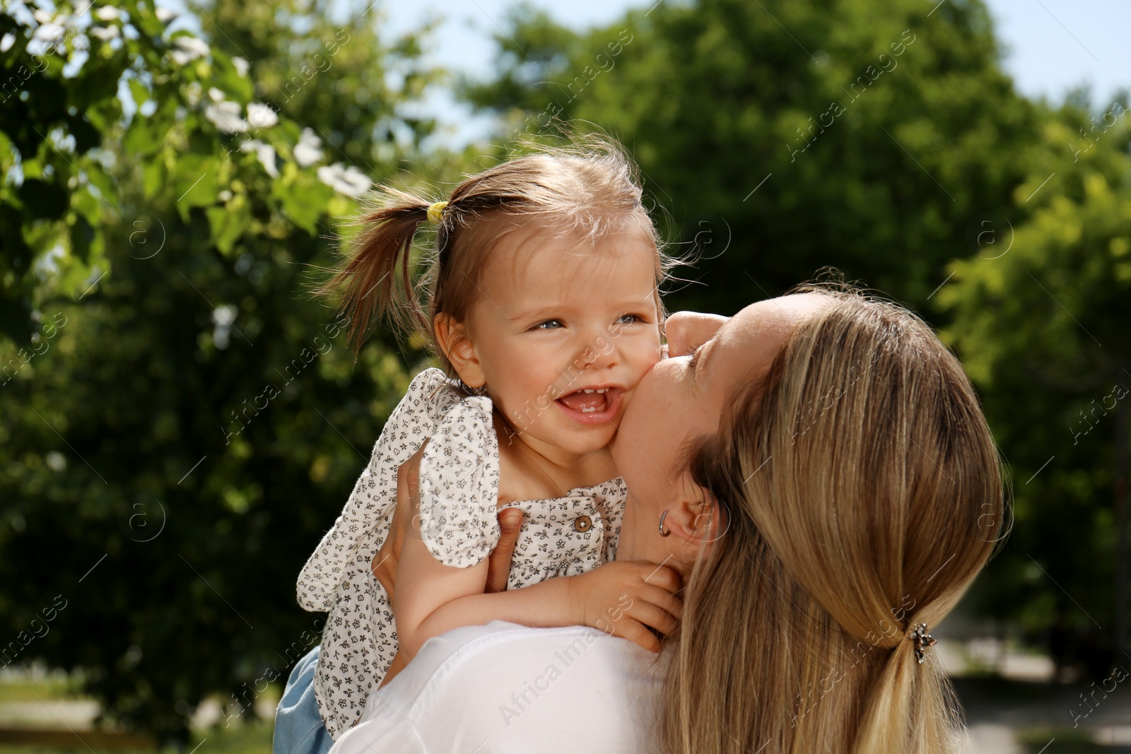 Photo of Mother with her daughter spending time together in park