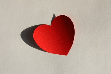 Photo of One paper heart on grey background, top view