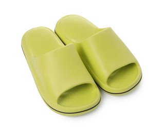 Photo of Pair of green rubber slippers isolated on white