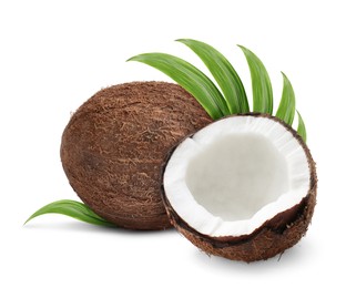 Image of Tasty ripe coconuts and green leaves on white background