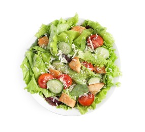 Photo of Delicious salad with chicken, cheese and vegetables in bowl isolated on white, top view
