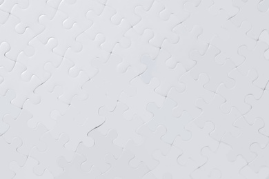 Photo of Blank white puzzle as background, top view