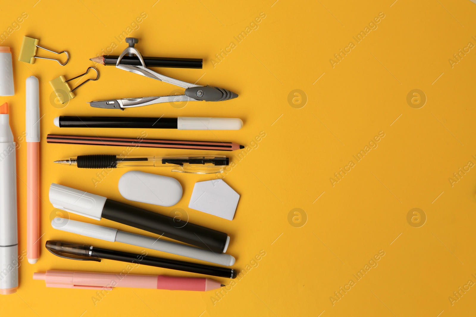 Photo of Flat lay composition with different school stationery on orange background, space for text. Back to school